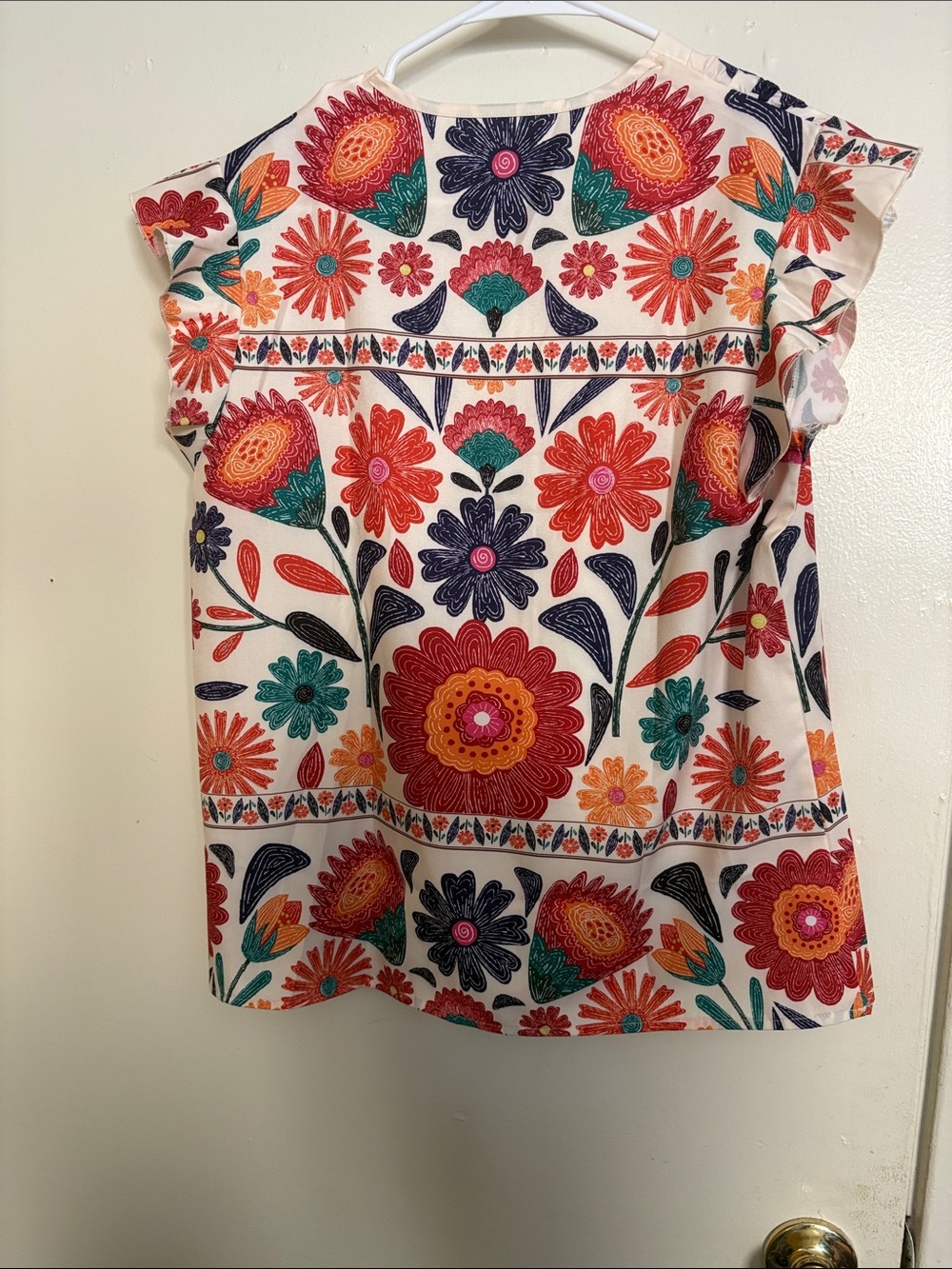 Emory Rose floral flutter sleeve top. - Picture 2 of 4